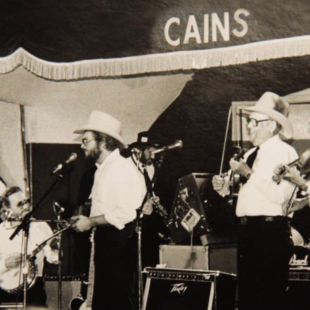 Merle Haggard on stage performing a tribute to Bob Wills