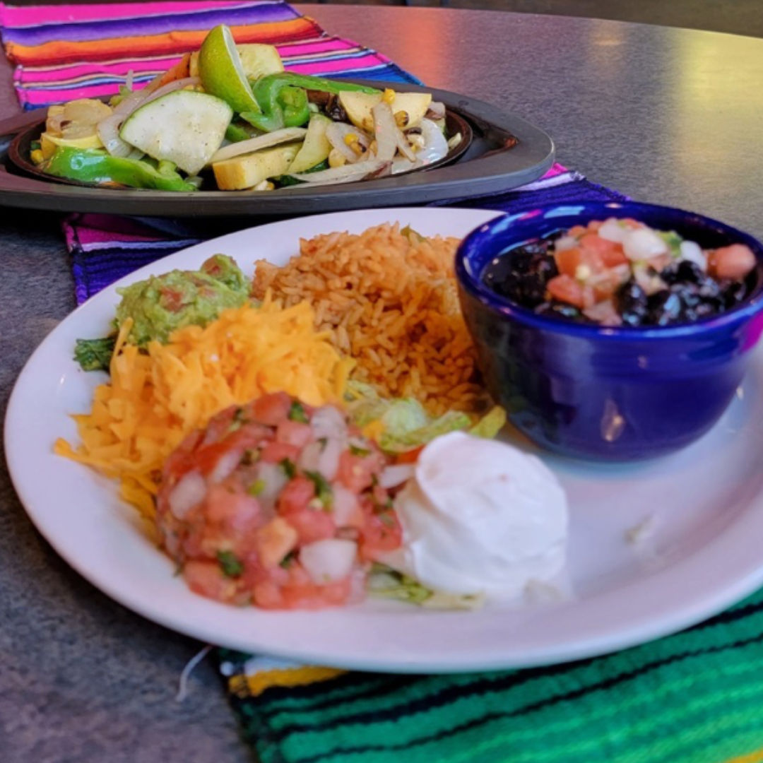 beans, rive, pico de gallo, and fajitas at Mexicali Border Cafe